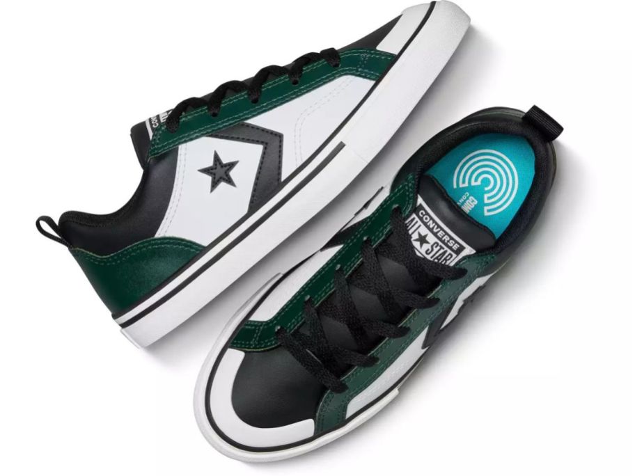 A pair of green and white Converse sneakers