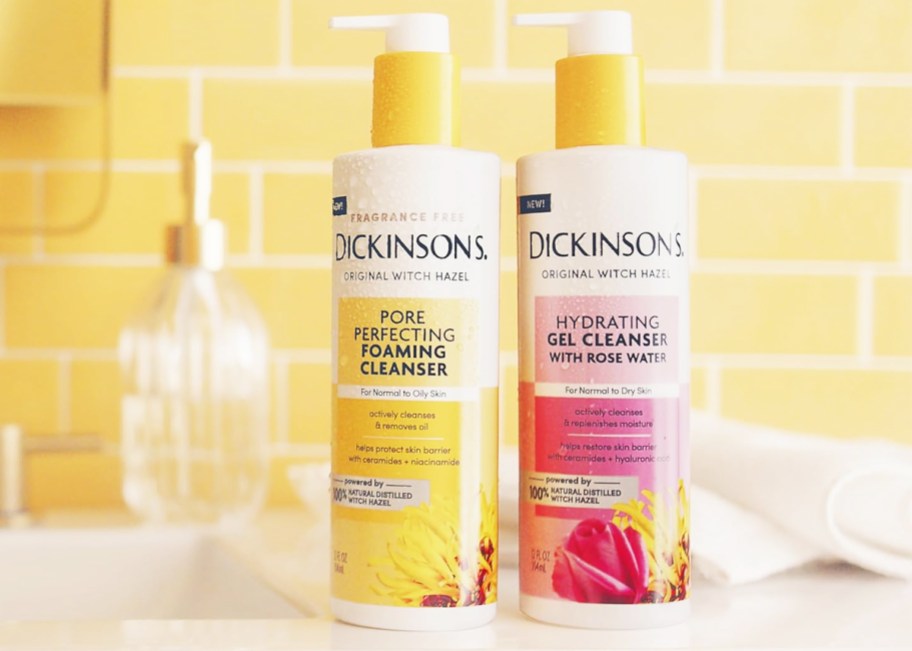 yellow and pink bottles of Dickinson's Witch Hazel Facial Cleansers on bathroom counter