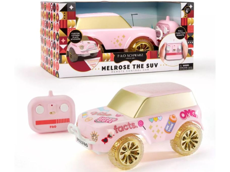 A pink toy SUV and a box