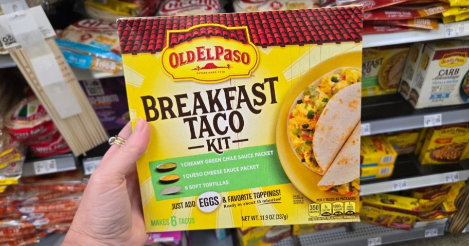 hand holding an Old El Paso Breakfast Taco Kit box in a store aisle