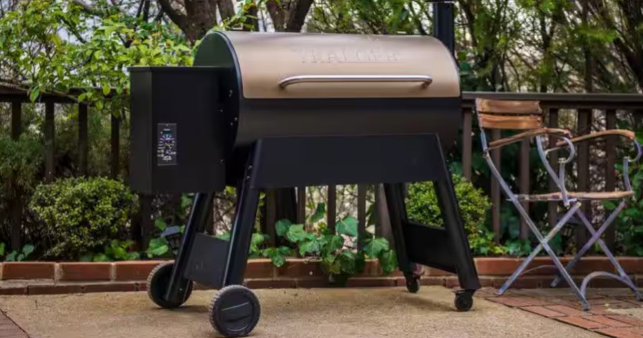 a large Traeger brand pellet grill sitting outside