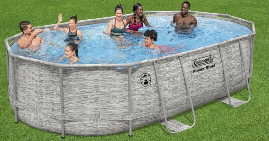 several kids and adults in an above ground pool in a backyard