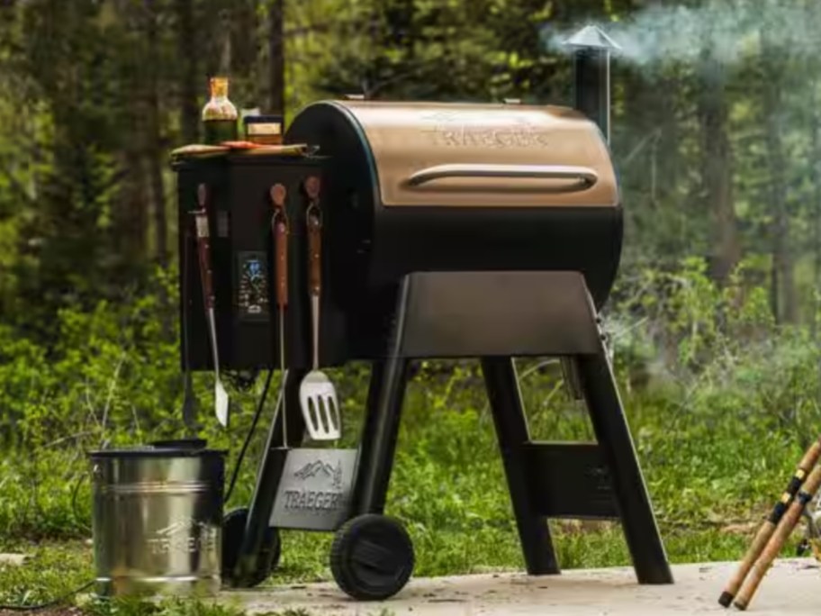 a Traeger brand pellet grill on a back patio