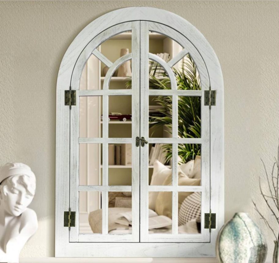 A Hochwertiges Farmhouse Arched Windowpane Mirror on a wall