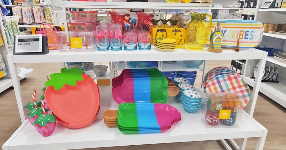store display table full of colorful summer kitchen and serving items