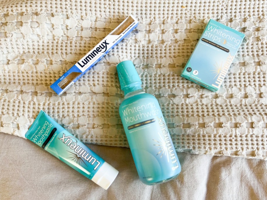 Lumineux Whitening Toothpaste, Whitening Mouthwash, Whitening Strips, and a toothbrush