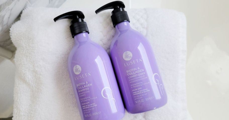 2 bottles of Luseta Biotin & collagen Shampoo on a white towel