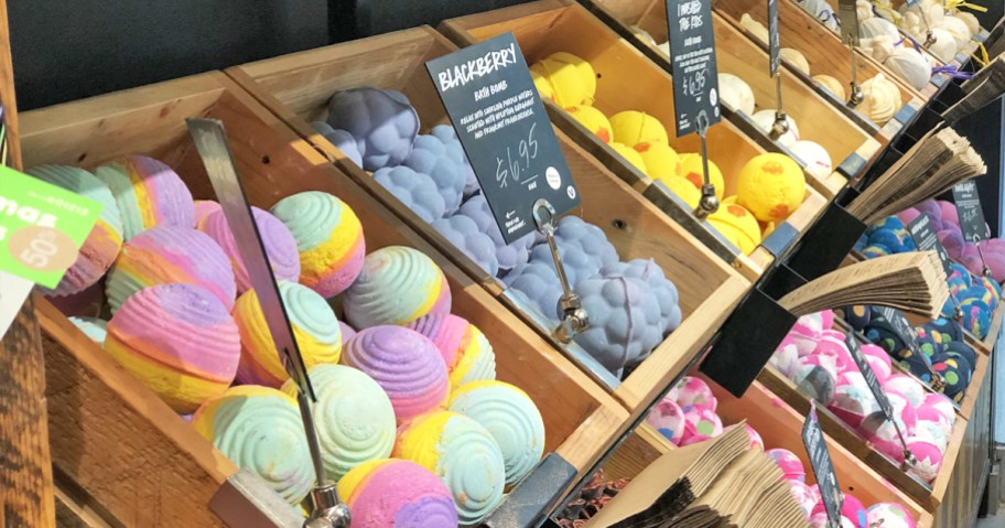 wood boxes full of different bath bombs in store