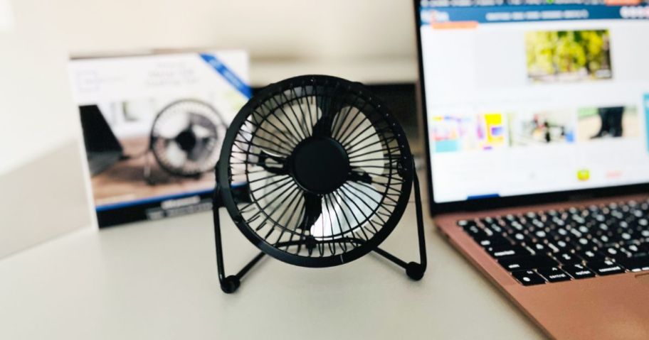 A Mainstays 4” Personal USB Powered Desktop Fan on a desk