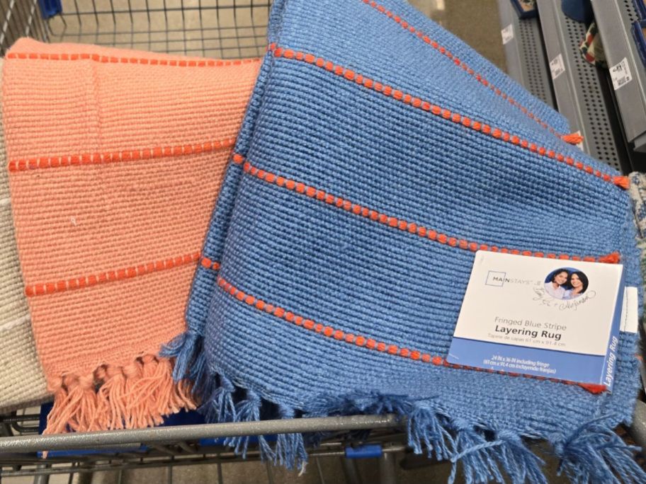 Mainstays by Becky G Layering rugs in a walmart shopping cart