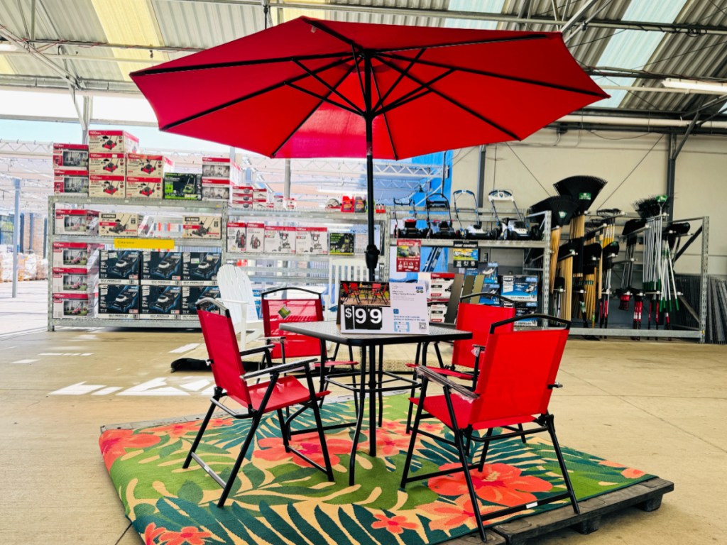Red mainstay patio set on display inside Walmart store