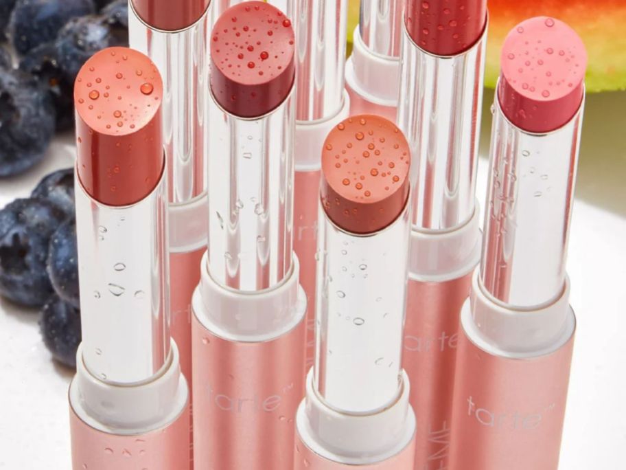 Several open tubes of Tarte maracuja lip cremes