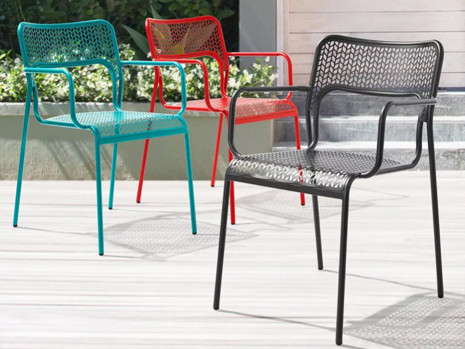 teal, red, and black metal patio chairs
