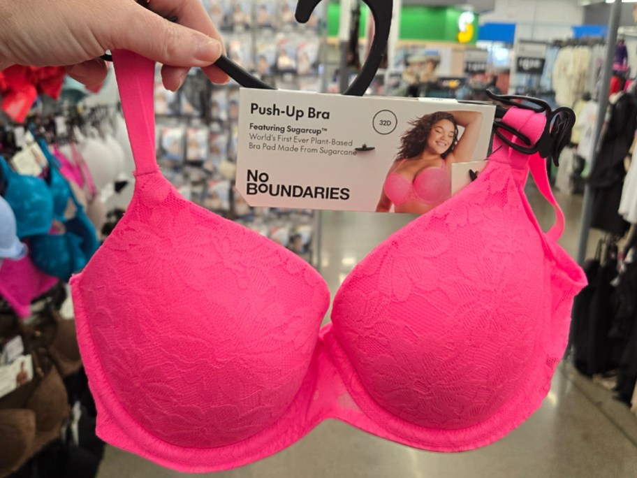No Boundaries All Over Lace Push Up Bra with Sugarcup in hot pink being held in a walmart