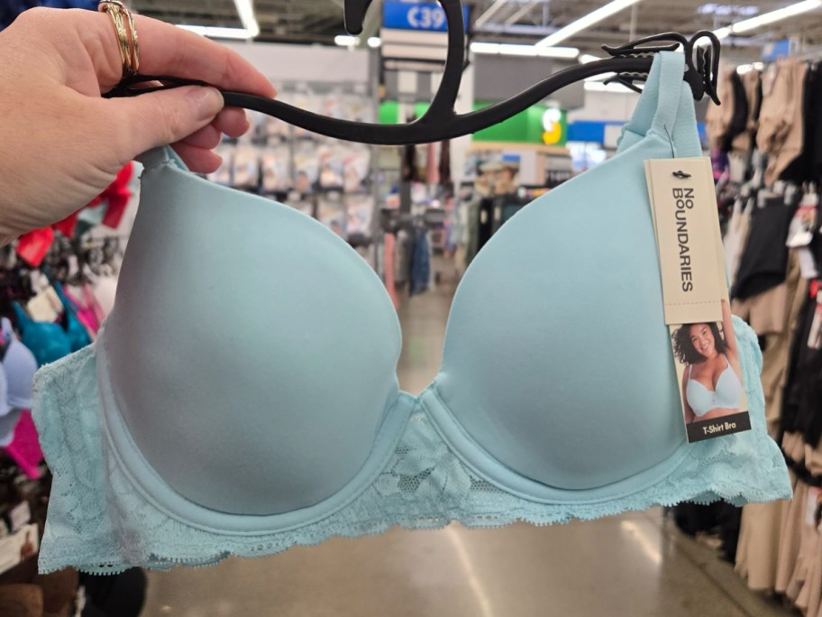 No Boundaries Demi Underwire T-Shirt Bra with Sugarcup in sky blue being held in a Walmart