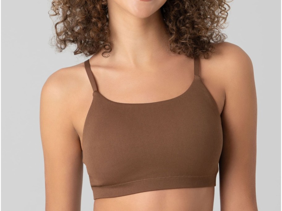 woman wearing No Boundaries Seamless Ribbed Cami Bralette in brown