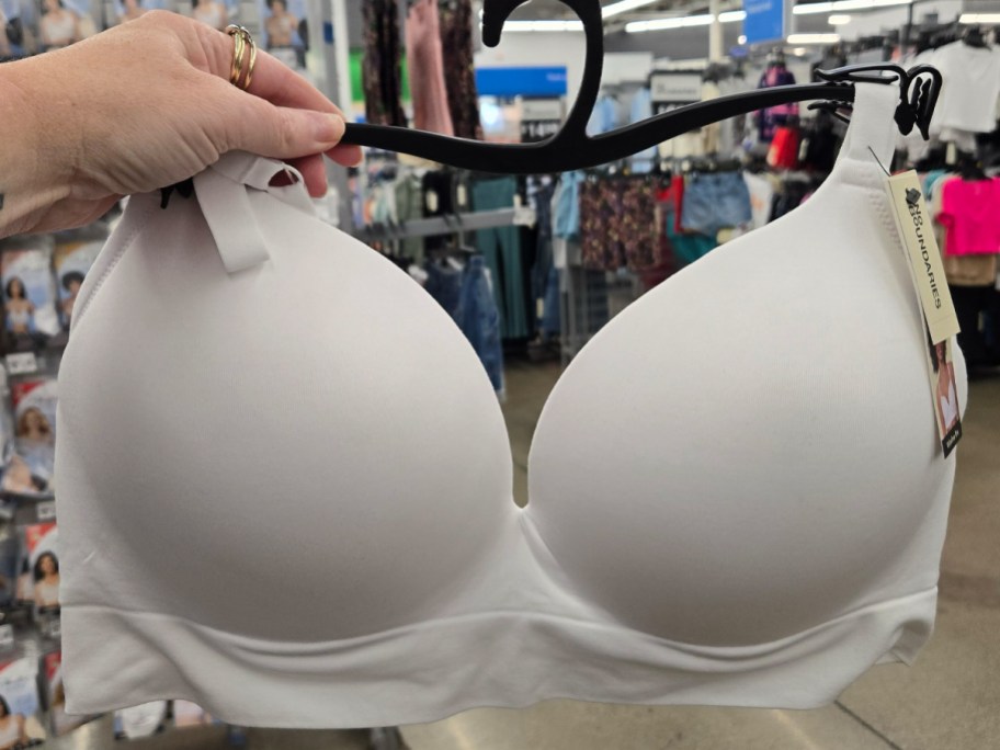 No Boundaries Seemless Wirefree Bra in white being held in a Walmart