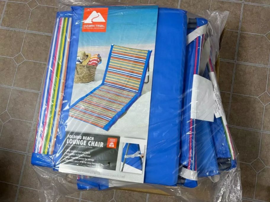 An Ozark Trail Folding Beach Lounge Chair in packaging 