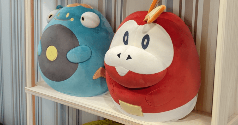 two Pokemon Squishmallows on shelf