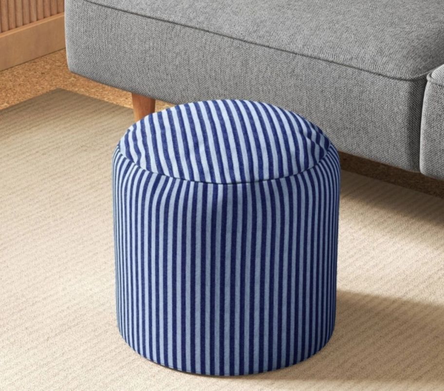 a blue striped foot stool pouf