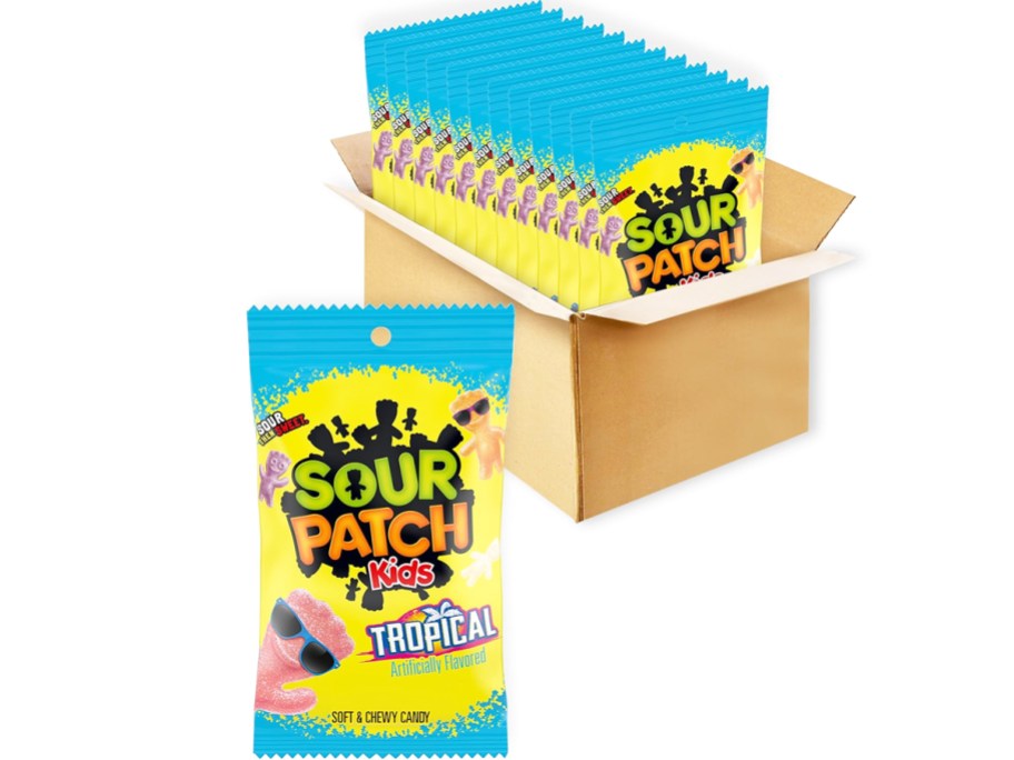 box full of bags of Sour Patch Kids Tropical candies with one large bag in front of the box