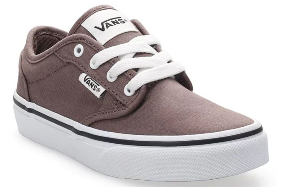 a brown Vans kid's shoe with aces