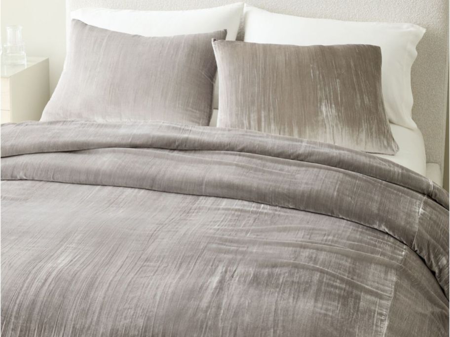 A Gray West Elm Velvet Comforter on a bed