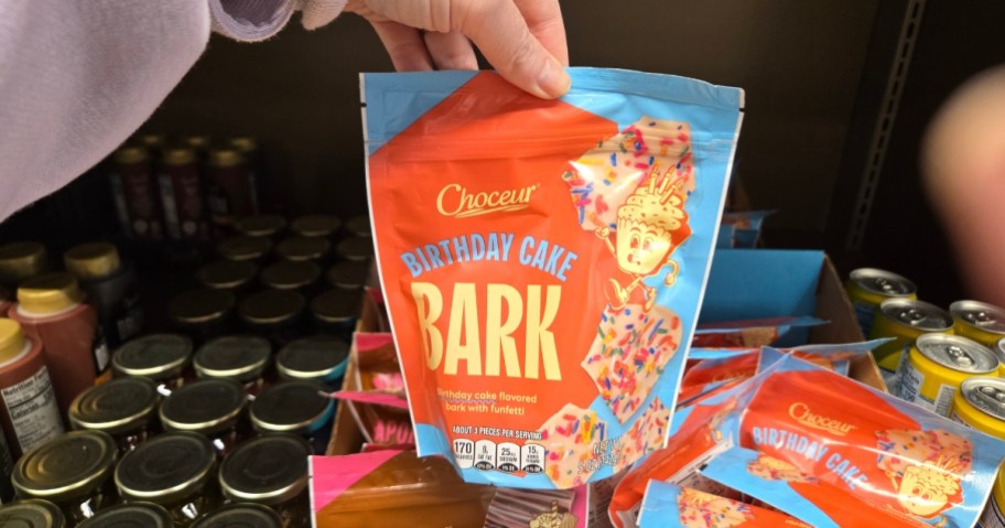 hand holding a bag of chocolate bark candy