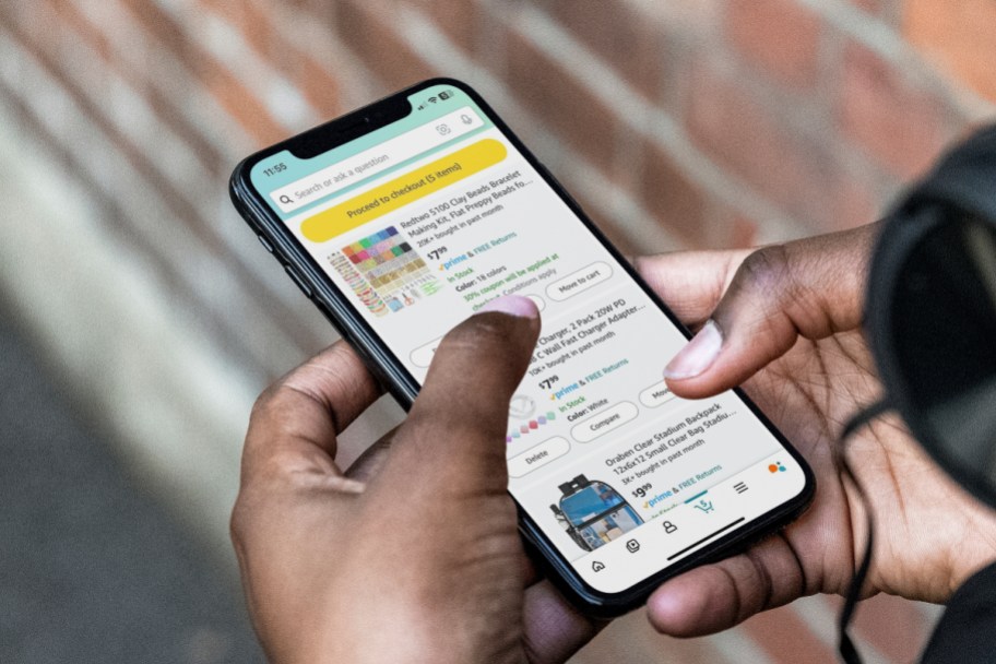 man scrolling Amazon cart on iphone