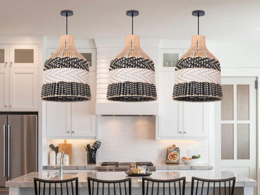 three black and white striped rattan pendant lights hanging in kitchen