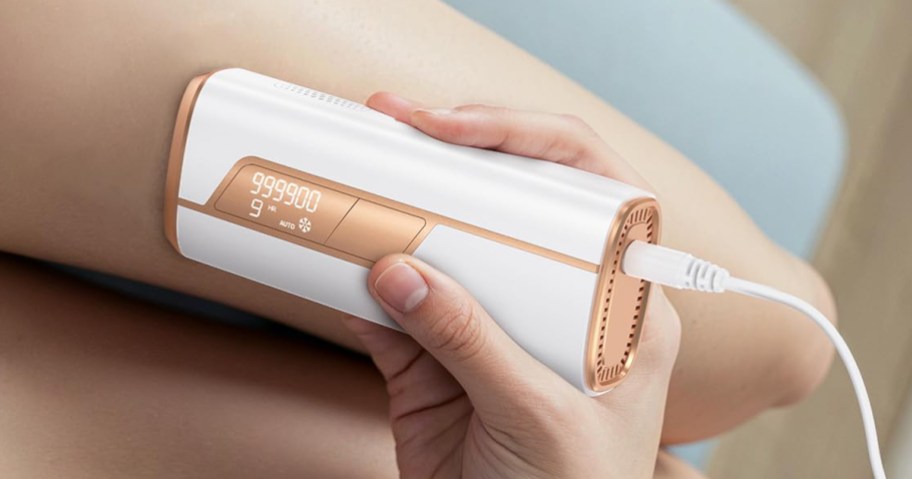 laser hair remover being used on legs