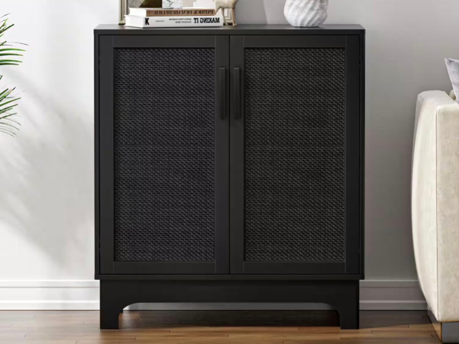 black sideboard table with rattan doors 