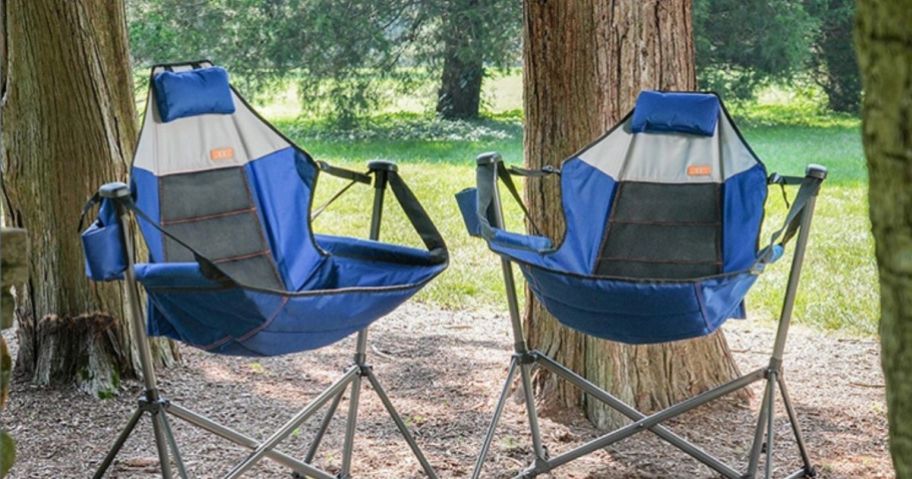 2 blue camping chairs in woods
