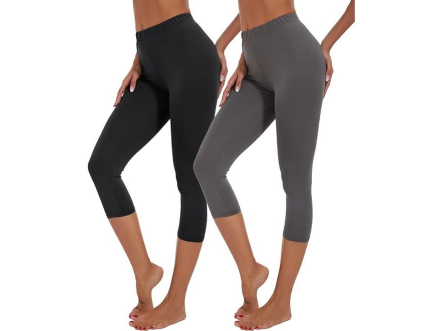 two women wearing capri leggings in black and grey