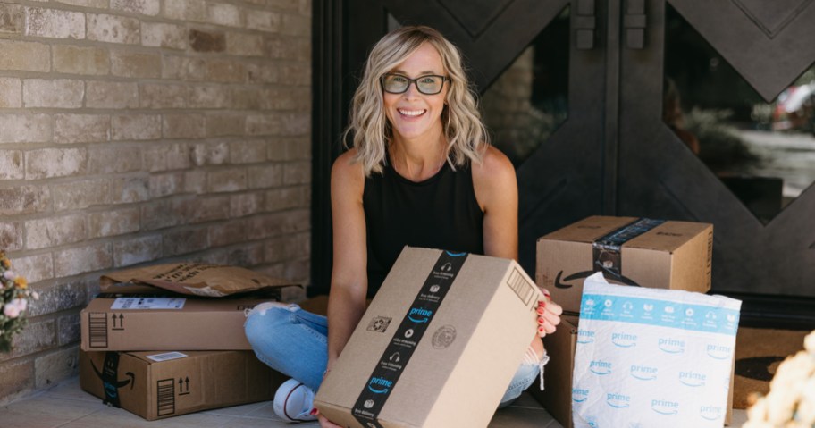 woman with Amazon packages on porch
