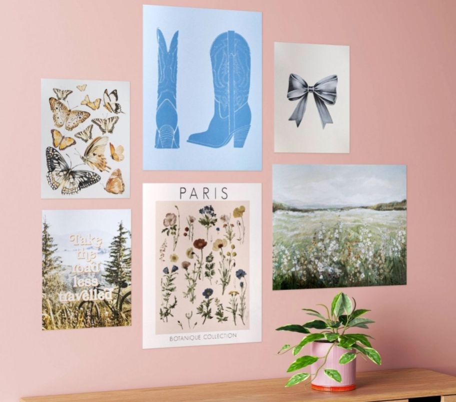 6 graphic posters in various sizes arranged on a wall