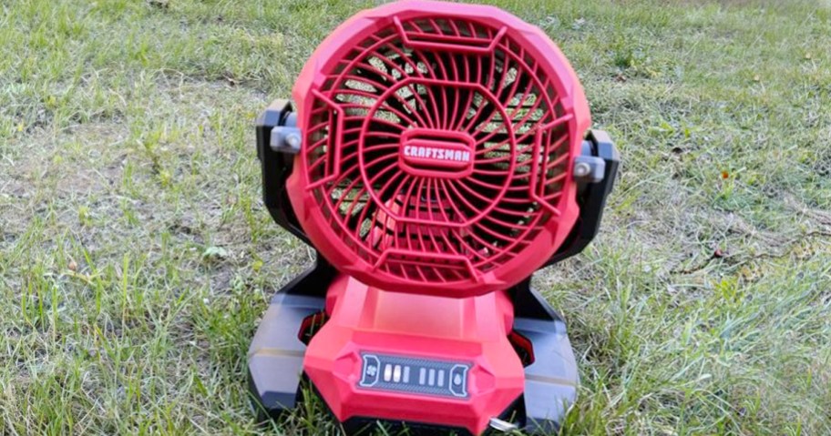 red craftsman misting fan sitting in grass