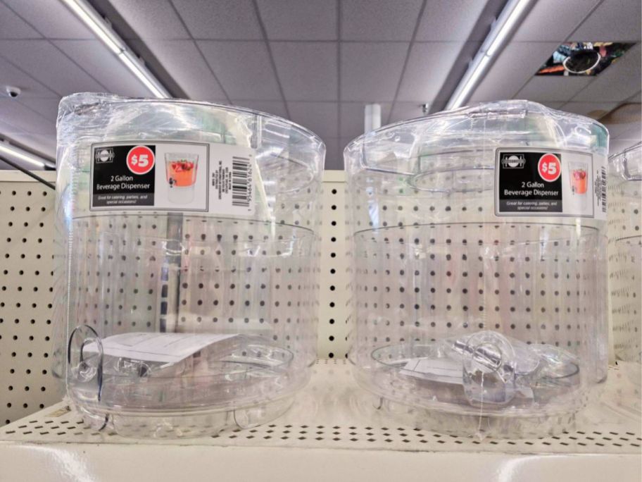 Two 2-gallon beverage dispensers on shelf at Dollar Tree