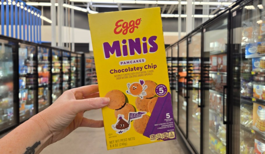 hand holding chocolate chip mini pancakes box in store 