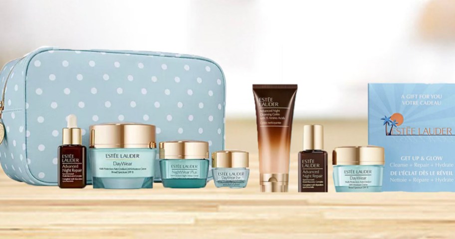 estee lauder skincare products with blue makeup bag on countertop 