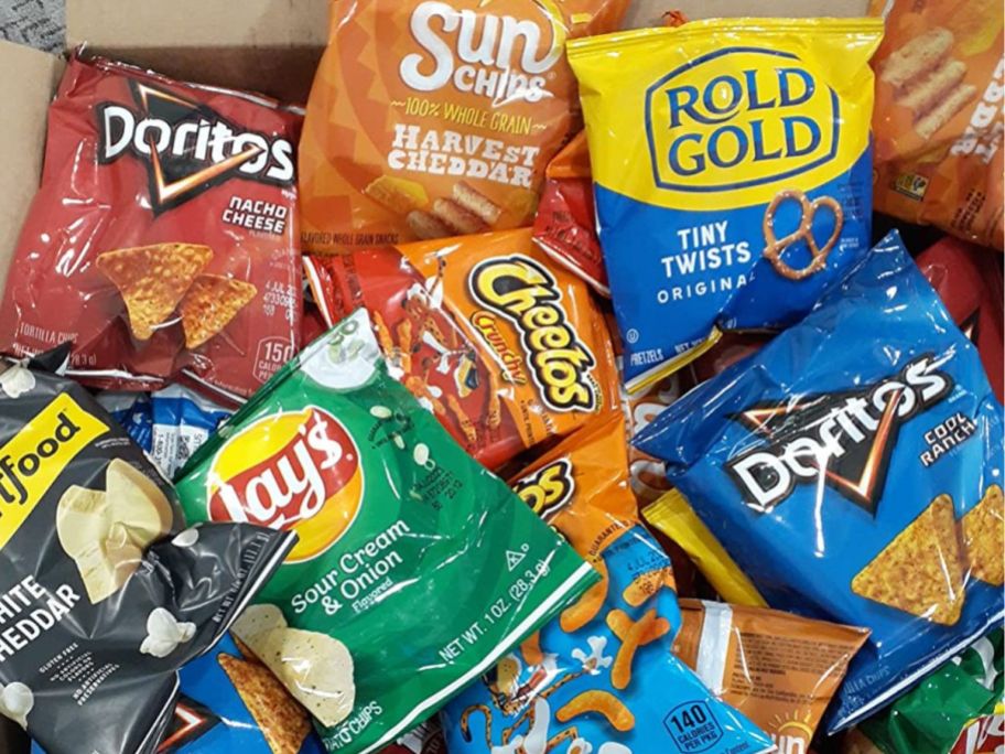 doritos, sun chips, rold gold, lays, and cheetos snack bags in delivery box