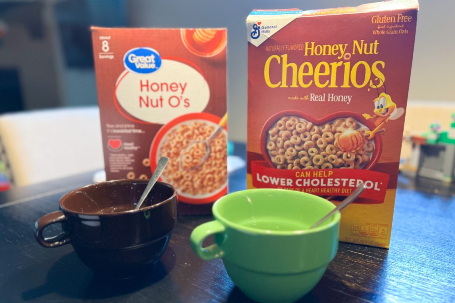 two boxed of honey o's cereal and two bowls