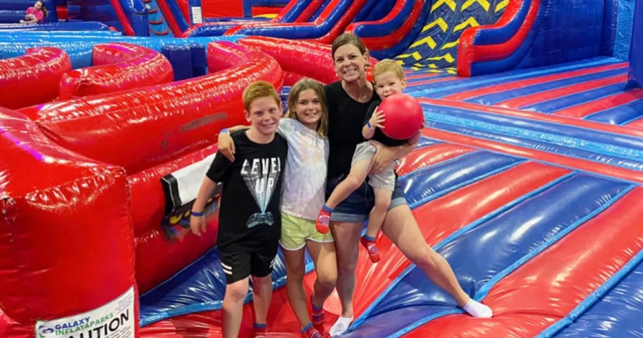 family standing in jump park