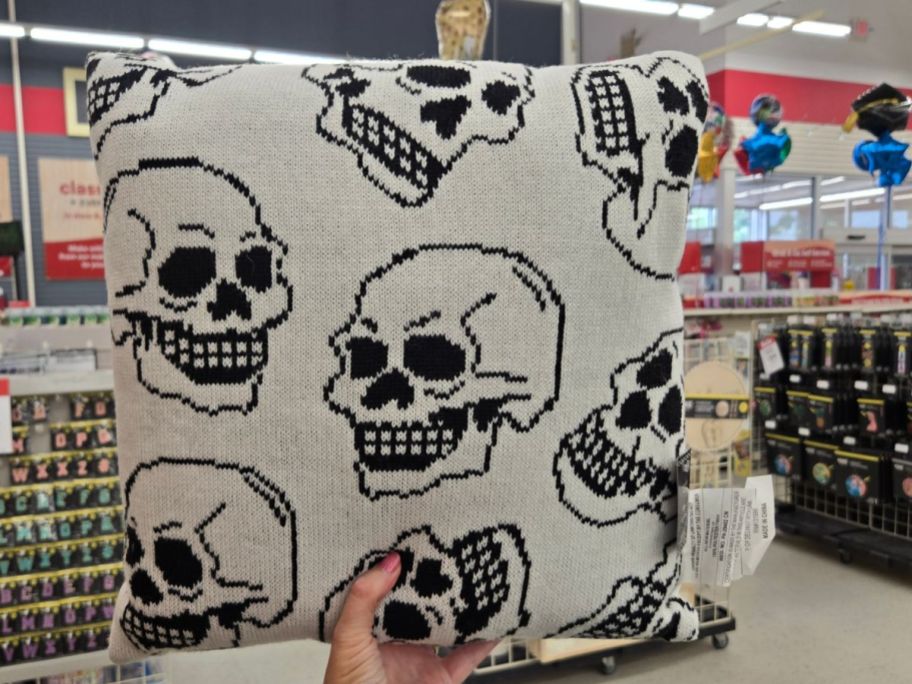 Ashland Skull Accent Pillow in hand in store