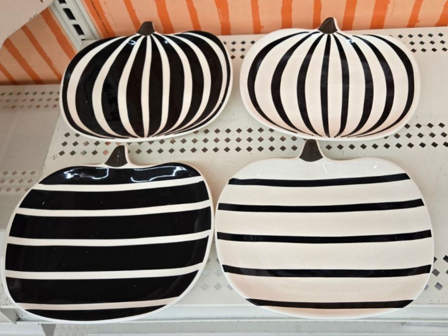 Ashland Assorted 8" Black & White Ceramic Pumpkin Plates on shelf in store