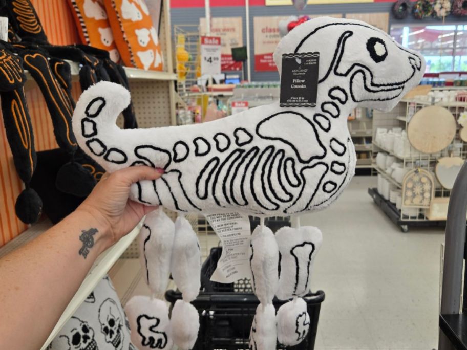 Ashland 21" Dog Skeleton Accent Pillow in hand in store
