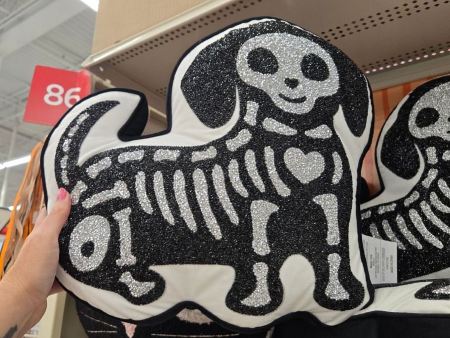 Ashland 16.5" Black & Silver Skeleton Dog Accent Pillow in hand in store