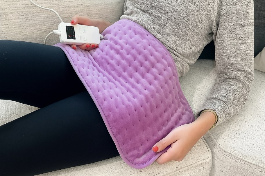person with heating pad on their lap