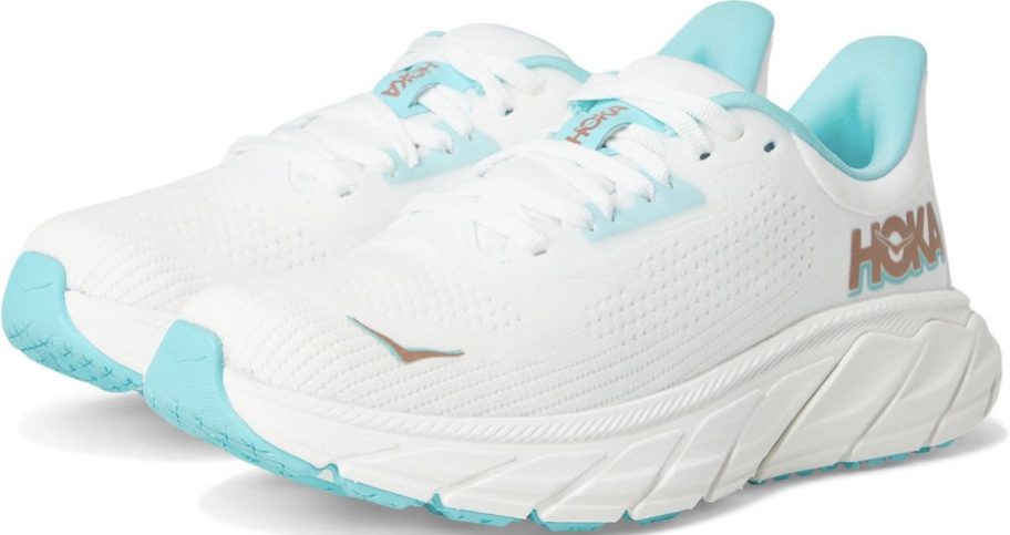 pair of white and blue hoka shoes