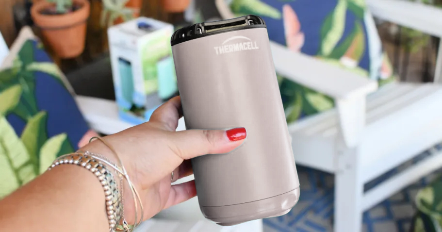 person holding a thermacell device